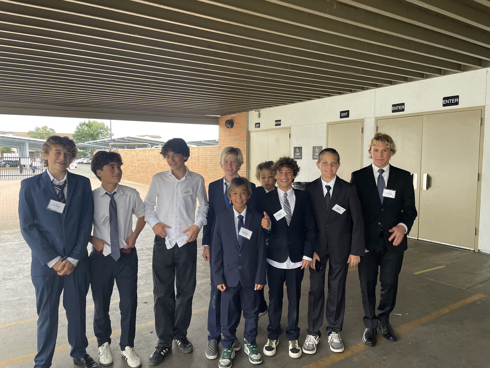 A group of Thurston delegates in suits outside the conference